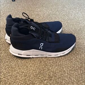 On Running Blue and White Athletic Shoes with CloudTec Technology